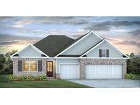 Charming two-story home with brick accents, gray siding, and a manicured lawn at 864 Ireland Dr., Longs, SC 29568