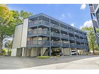 Multi-level condo building with covered parking, private balconies, and easy access to the beach at 1500 Cenith Dr. # B402, North Myrtle Beach, SC 29582