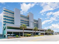 Exterior of the San-A-Bel building in Myrtle Beach with blue and white paint and palm trees at 1709 S Ocean Blvd. # 608, North Myrtle Beach, SC 29582