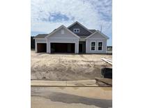 New construction two-car garage home with gray siding and architectural shingle roof at 186 Glengrove Lane, Murrells Inlet, SC 29576