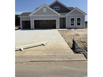 New construction home with a three car garage and a concrete driveway at 186 Glengrove Lane, Murrells Inlet, SC 29576