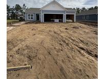 New construction home featuring light blue siding and a two-car garage at 187 Glengrove Lane, Murrells Inlet, SC 29576