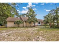 Charming single story home with beige stucco exterior and mature landscaping at 415 42Nd Ave. N, Myrtle Beach, SC 29577