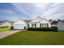 Charming single-story home featuring a well-manicured lawn and red shutters, perfect curb appeal at 1117 Jumper Trail Circle, Myrtle Beach, SC 29588