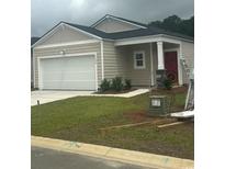 Cozy single-story home featuring a one-car garage, red front door, and manicured lawn at 1154 Silver Perch Place, Sunset Beach, NC 28468