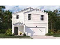 Charming two-story home featuring a covered front porch and an attached two-car garage at 378 Ladyfish Loop, Sunset Beach, NC 28468