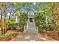 Charming two-story home with a welcoming front porch and meticulously maintained landscaping at 486 Lantana Circle, Georgetown, SC 29440