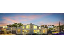 Inviting exterior view of a modern home featuring large windows, fresh paint and professional landscaping at 800 9Th Ave. S # A-4, North Myrtle Beach, SC 29582