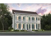 Charming two-story home with a double porch, dark shutters and manicured landscaping at 1079 Milford Way, Myrtle Beach, SC 29588