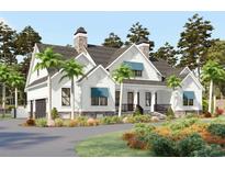 Charming two-story home with white siding, stone accents, and inviting front porch with manicured landscaping at 2208 Bentbill Circle, North Myrtle Beach, SC 29582