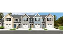 Charming townhomes showcase a modern design with attached garages and colorful front doors at 3208 Nw Edgemead Circle # B, Calabash, NC 28467