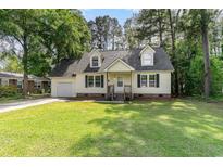 Charming home with a well-manicured lawn and dormer windows at 505 Forestbrook Dr., Myrtle Beach, SC 29579