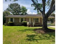 Charming single-story brick home with well-maintained lawn and mature tree in a desirable neighborhood at 615 Burcale Road Circle, Myrtle Beach, SC 29579