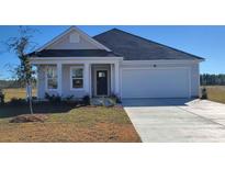 Charming one-story home with a two-car garage and beautiful landscaping at 619 Culmen Ct., Myrtle Beach, SC 29588