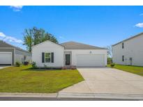 Charming single-story home with a well-maintained lawn and attached two-car garage at 109 River Vista Way, Myrtle Beach, SC 29588