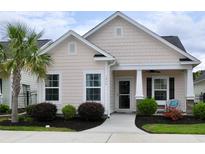 Charming single-story home featuring a manicured lawn and a welcoming covered front porch at 1308 Riverport Dr., Conway, SC 29526