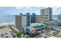 A view of the Landmark Resort with a large building near the beach and the beach across the street at 1501 S Ocean Blvd. # 1044, Myrtle Beach, SC 29577