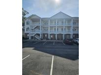 Beautiful three-story condo complex with ample parking in a well-maintained community at 4449 Turtle Ln. # 3A, Little River, NC 29566