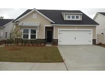 Charming single-Gathering home with a two-car garage and well-maintained landscaping at 8727 Baton Rouge Ave Nw, Calabash, NC 28467