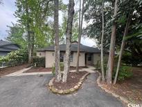 Charming single-story home featuring a landscaped front yard and neutral exterior at 116 Hickory Dr., Conway, SC 29526