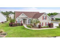 Inviting one story home boasts manicured landscaping and a beautiful lawn at 127 Willow Bay Dr., Murrells Inlet, SC 29576