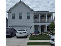Charming two-story home with a welcoming front porch and well-manicured landscaping at 1295 Safe Haven Dr., Myrtle Beach, SC 29579