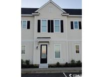 Charming two-story townhome with black shutters, neutral siding, and well-maintained landscaping at 2800 Cook Circle # B, Myrtle Beach, SC 29577