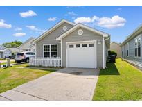 Charming single-story home boasts a well-manicured lawn and attached one car garage at 408 Chesterfield Ct., Myrtle Beach, SC 29577