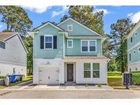 Charming two-story home with a garage, a wreath on the door, and a beautifully painted exterior at 4698 Cloisters Ln., Myrtle Beach, SC 29577