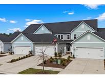 Charming townhomes feature attached garages, well-manicured landscaping and neutral exterior paint at 5371 Knobcone Loop # D, Myrtle Beach, SC 29577