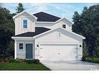 Charming two-story home featuring white siding, a two-car garage, and a well-manicured lawn at 871 Cypress Preserve Circle, Longs, SC 29568