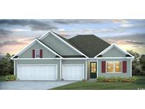 Charming single-Gathering home featuring a two-car garage and landscaped front yard at 885 Ireland Dr., Longs, SC 29568