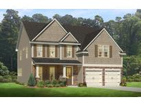 Charming two-story home features a two-car garage, brick accents, and a well-maintained lawn at 890 Ireland Dr., Longs, SC 29568