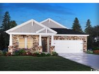 Charming single-story home featuring stone accents, a two-car garage, and a manicured lawn at 908 Cypress Preserve Circle, Longs, SC 29568
