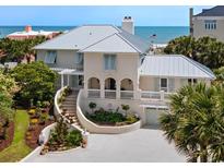 Stunning beachside home with a metal roof, manicured landscape, and gorgeous ocean views at 109 Pioneer Loop, Georgetown, SC 29440