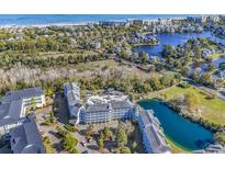 Stunning aerial view of the community showcases its proximity to the beach, a pond, and manicured landscapes at 14290 Ocean Hwy. # 210, Pawleys Island, SC 29585