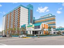 Brightly colored Landmark Resort exterior view showcases architecture and tropical landscaping in an inviting coastal setting at 1501 South Ocean Blvd. # 643, Myrtle Beach, SC 29577