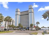 Beautiful exterior view of the Boardwalk Beach Resort with palm trees and blue skies in Myrtle Beach, South Carolina at 2300 N Ocean Blvd. # 1430, Myrtle Beach, SC 29577