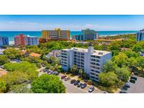 Beautiful aerial view of condo building, showcasing nearby beach and lush greenery at 311 71St Ave. N # 5A, Myrtle Beach, SC 29572