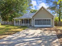 Charming single-story home with a welcoming front porch and screened in garage in a mature neighborhood at 314 Trace Run, Myrtle Beach, SC 29588
