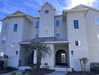 Charming condo building featuring a well-manicured entrance, and crisp architectural details at 4425 Eastport Blvd. # I-1, Little River, SC 29566