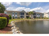 Beautiful condominium building overlooking the lush landscaped grounds and tranquil lake at 8887 Chandler Dr. # A, Myrtle Beach, SC 29575