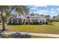 Charming one-story home with stone and siding, and well-manicured lawn at 1028 Whooping Crane Dr., Conway, SC 29526