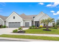 Charming home boasts a manicured lawn, landscaping, a two-car garage, and inviting curb appeal at 1211 Arezzo Ave., Myrtle Beach, SC 29572