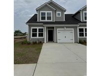 Charming home featuring gray siding, black roof, and a one-car attached garage at 1307 American Shad Dr. # 47, Conway, SC 29526