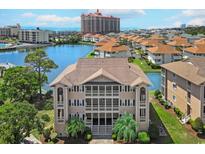 Beautiful three story condo building overlooking a tranquil lake and lush landscaping at 1900 Duffy St. # A8, North Myrtle Beach, SC 29582