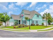 Beautiful two-story home with a well-manicured lawn, charming curb appeal, and street sign at 2004 Crow Field Ct., Myrtle Beach, SC 29579