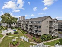 Beautiful condo complex with well-manicured lawns and plenty of trees at 204 Maison Dr. # N304, Myrtle Beach, SC 29572