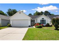 Charming one-story home with well-maintained lawn and colorful landscaping at 4591 Hidden Creek Ln., Myrtle Beach, SC 29579