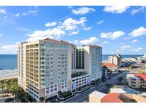 Beautiful condo building on a bright, sunny day near the ocean, with easy access to a busy street at 603 S Ocean Blvd. # 1101, North Myrtle Beach, SC 29582